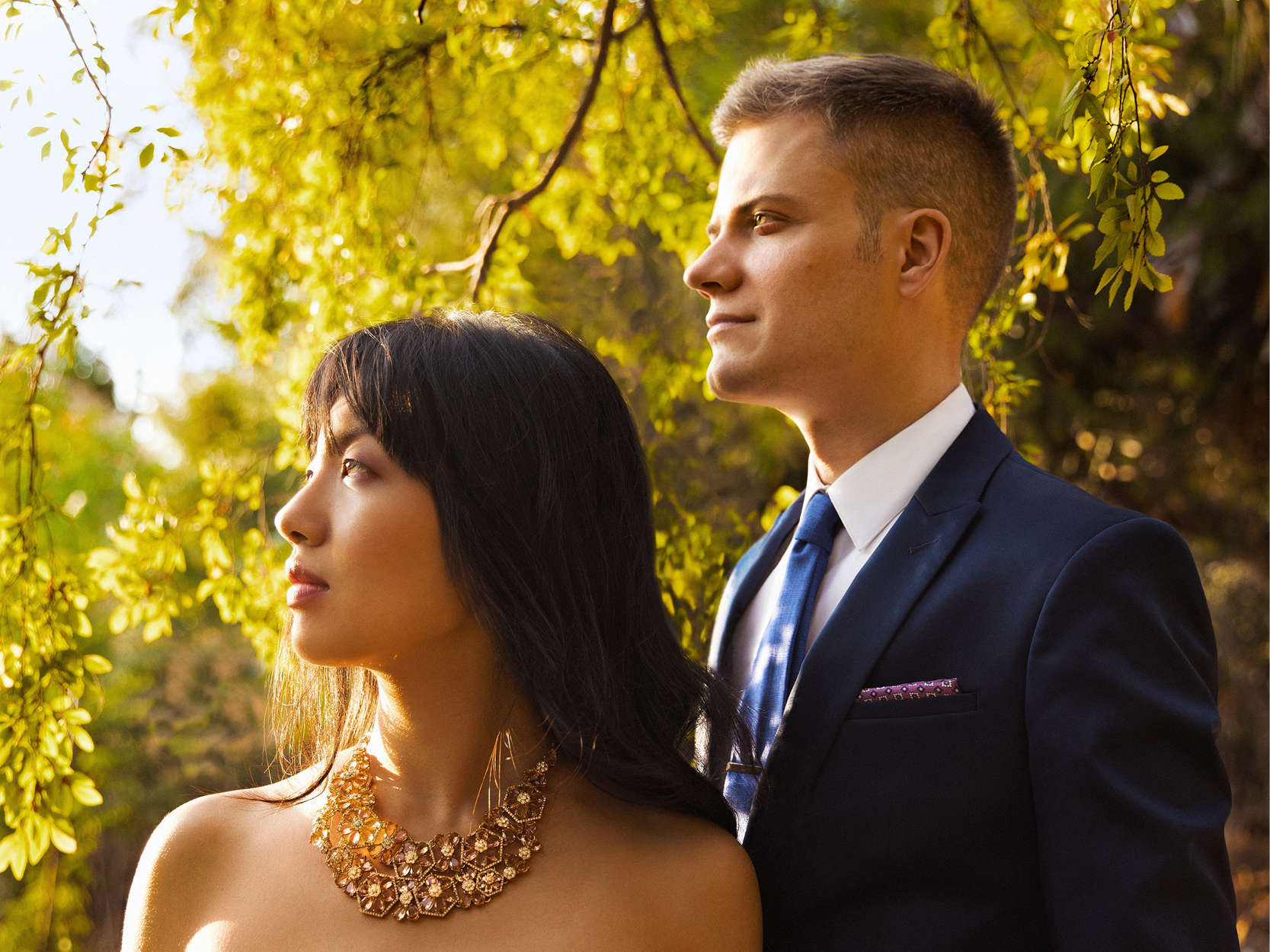 A man and a women looking off into the distance