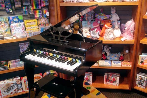 A mini piano inside of a store