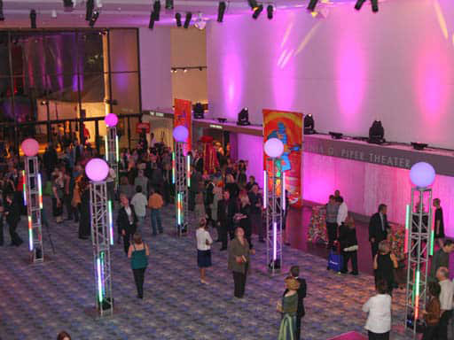 people in event lobby with colored lights